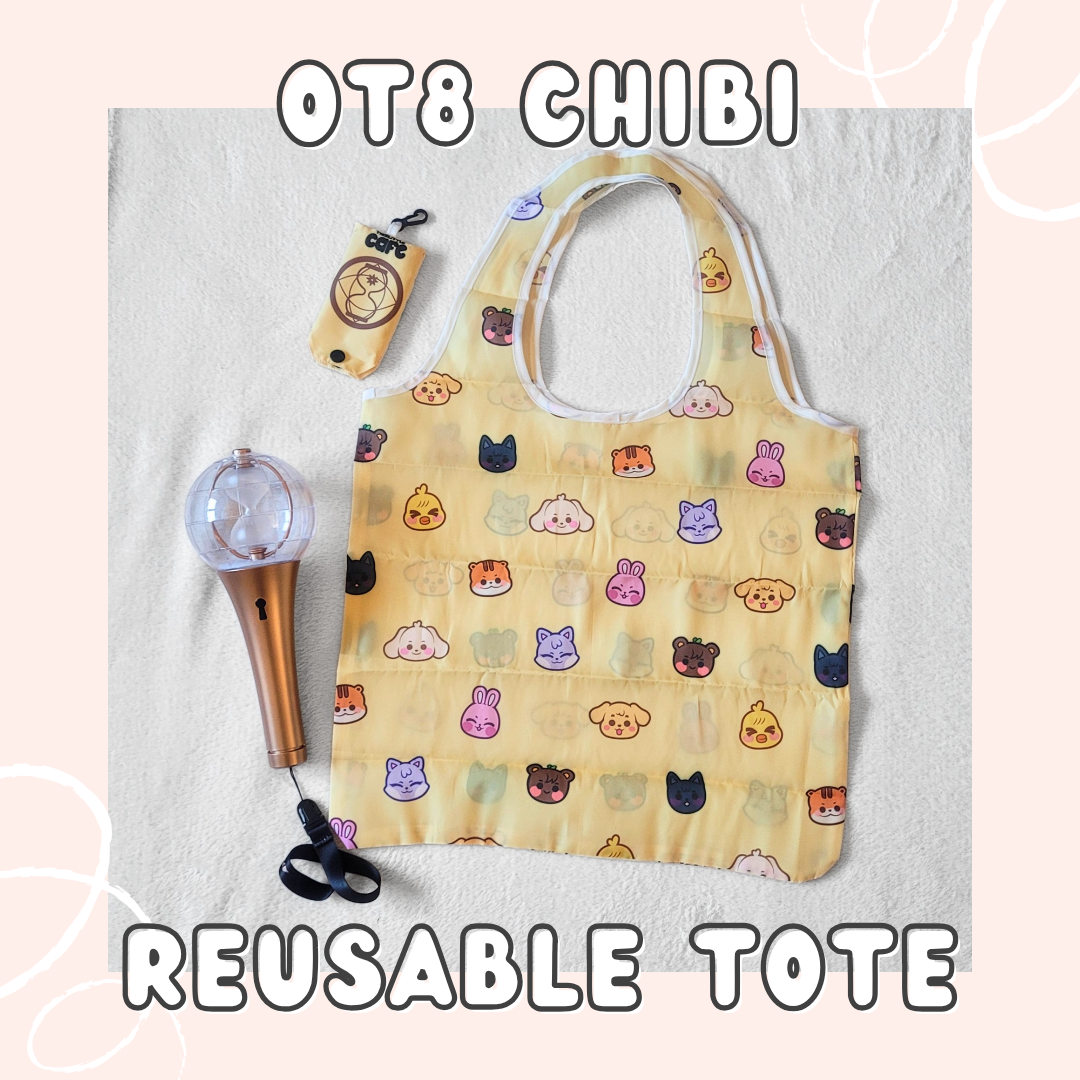 A yellow tote bag with Ateez's Aniteez characters on a white background. A 2nd generation ateez lightstick is on the left side. The tote storage clip-on bag is on the top-left of the image. The words "OT8 CHIBI" is at the top of the image and the words "REUSABLE TOTE" in white font are at the bottom of the image on a light-pink background.